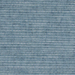 Detail of a sisal grasscloth wallpaper in mottled blue on a paper backing.