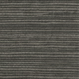 Detail of a sisal grasscloth wallpaper in light gray on a dark gray paper backing.