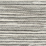 Detail of a grasscloth wallpaper in textured black and white on a paper backing.