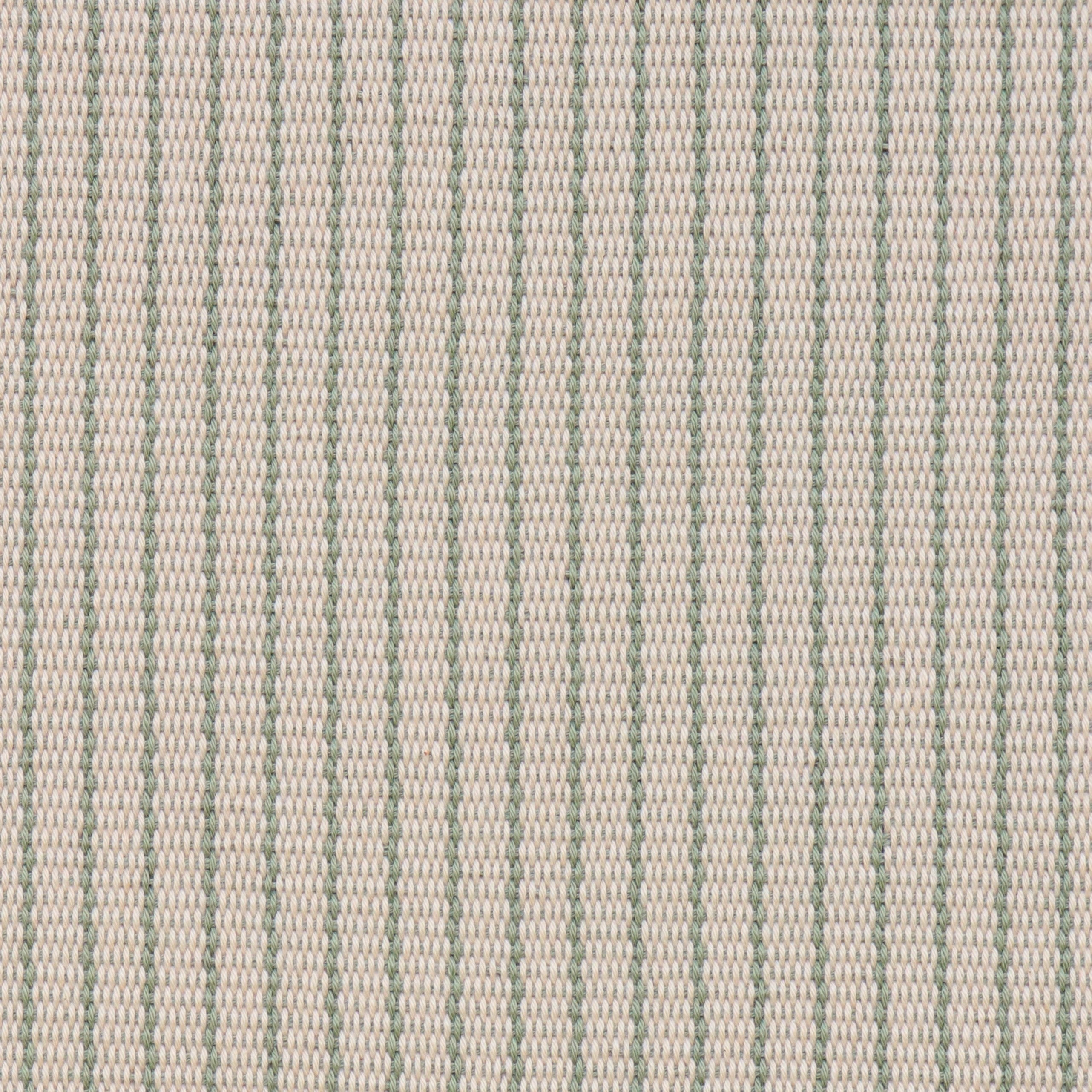 Handwoven fabric detail in a cream and sage green stripe.