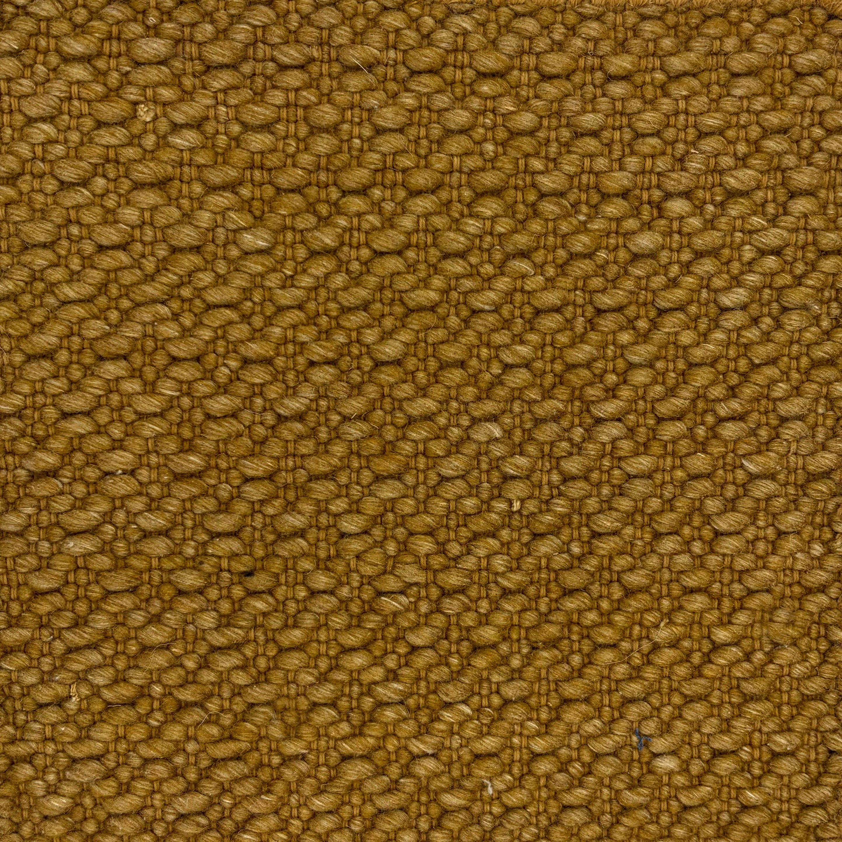 Flatweave rug with subtle lattice weave in ochre. 