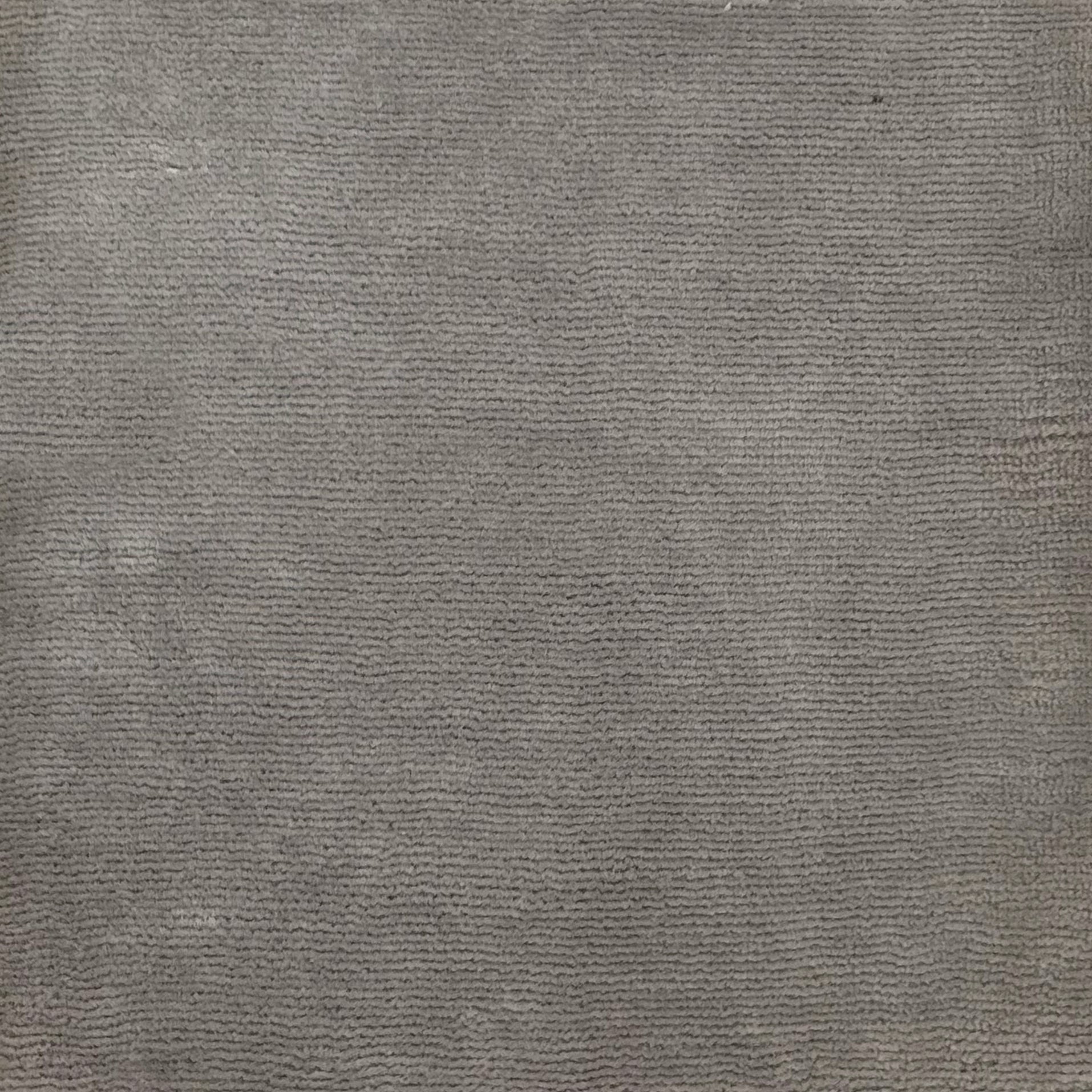 Handknotted rug with solid cut pile in grey merino-silk
