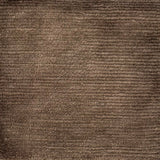 Handknotted rug with solid cut pile in warm brown wool. 