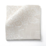 Fabric swatches in a painterly cloud pattern in white on a beige watercolor field.