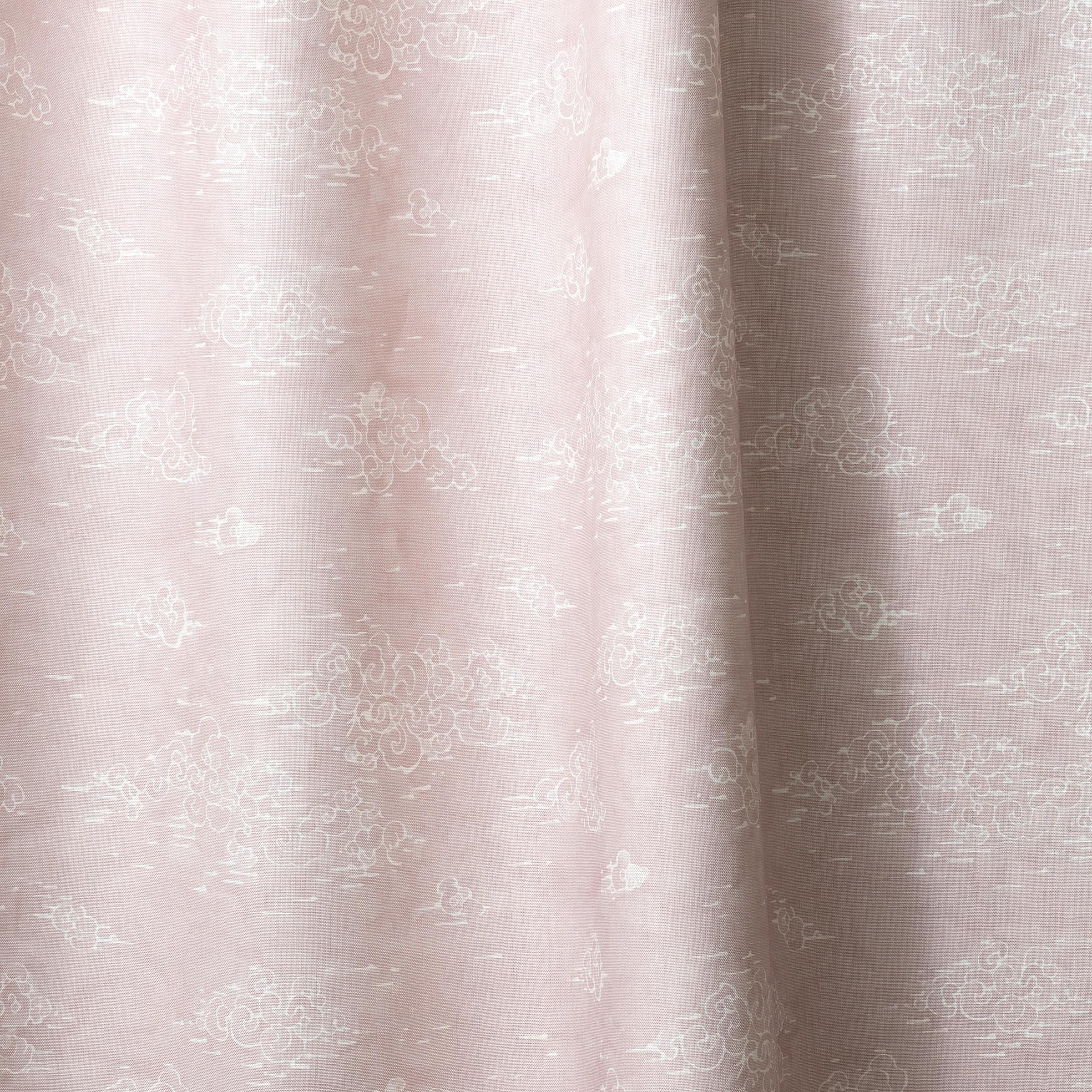 Draped fabric a painterly cloud pattern in white on a pastel pink watercolor field.