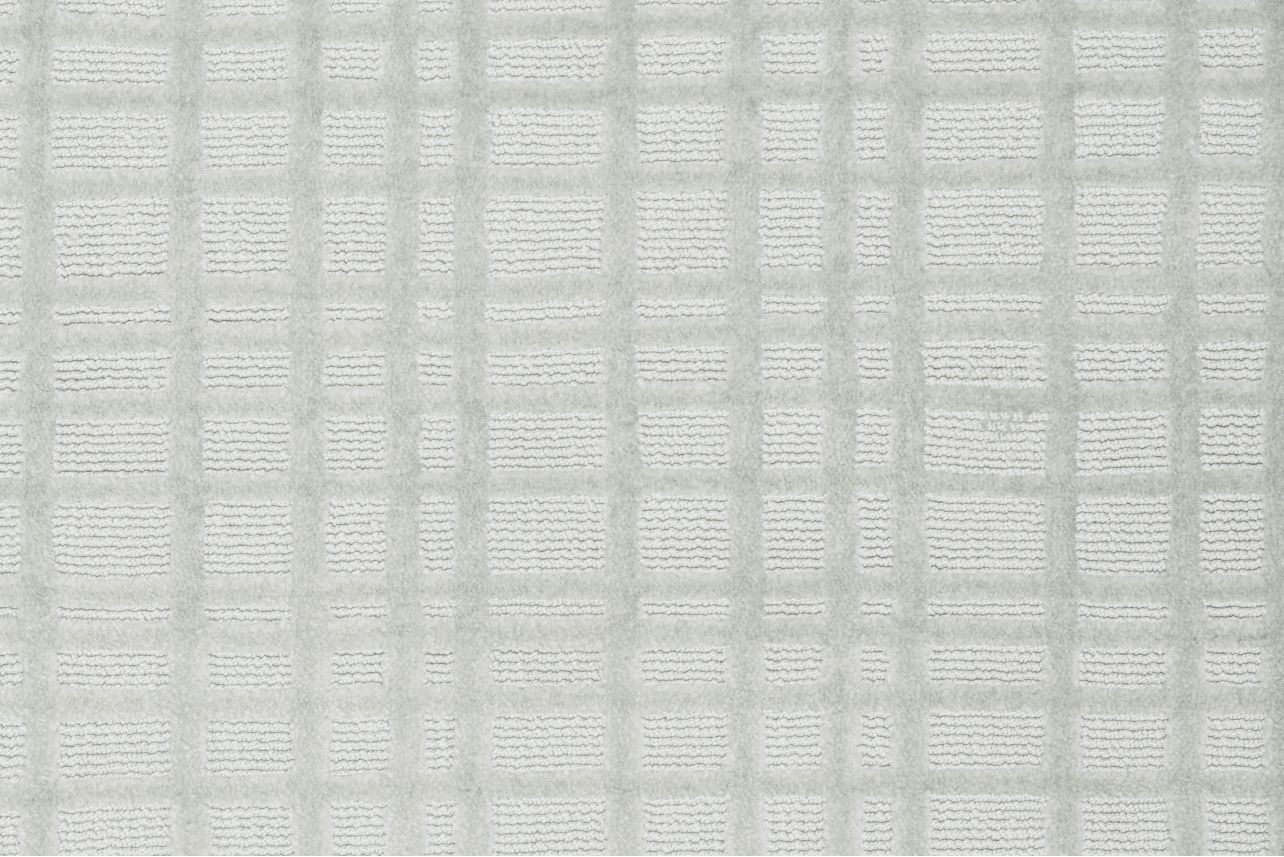 Broadloom carpet in a dimensional check lattice in cool white.