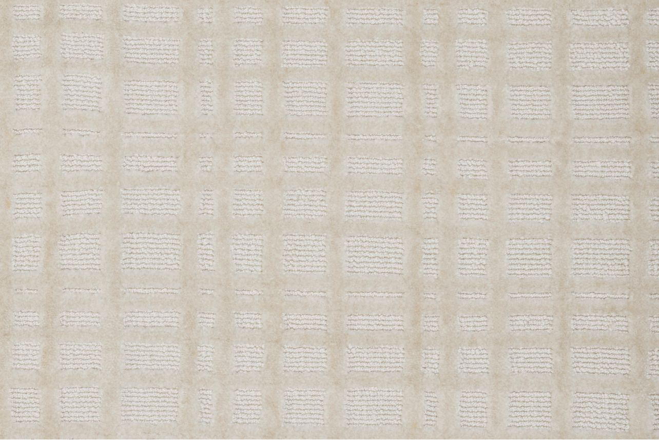 Broadloom carpet in a dimensional check lattice in cream.