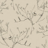 Detail of fabric in a painterly bird and branch pattern in shades of gray on a tan field.