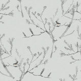 Detail of wallpaper in a painterly bird and branch pattern in shades of gray on a light gray field.