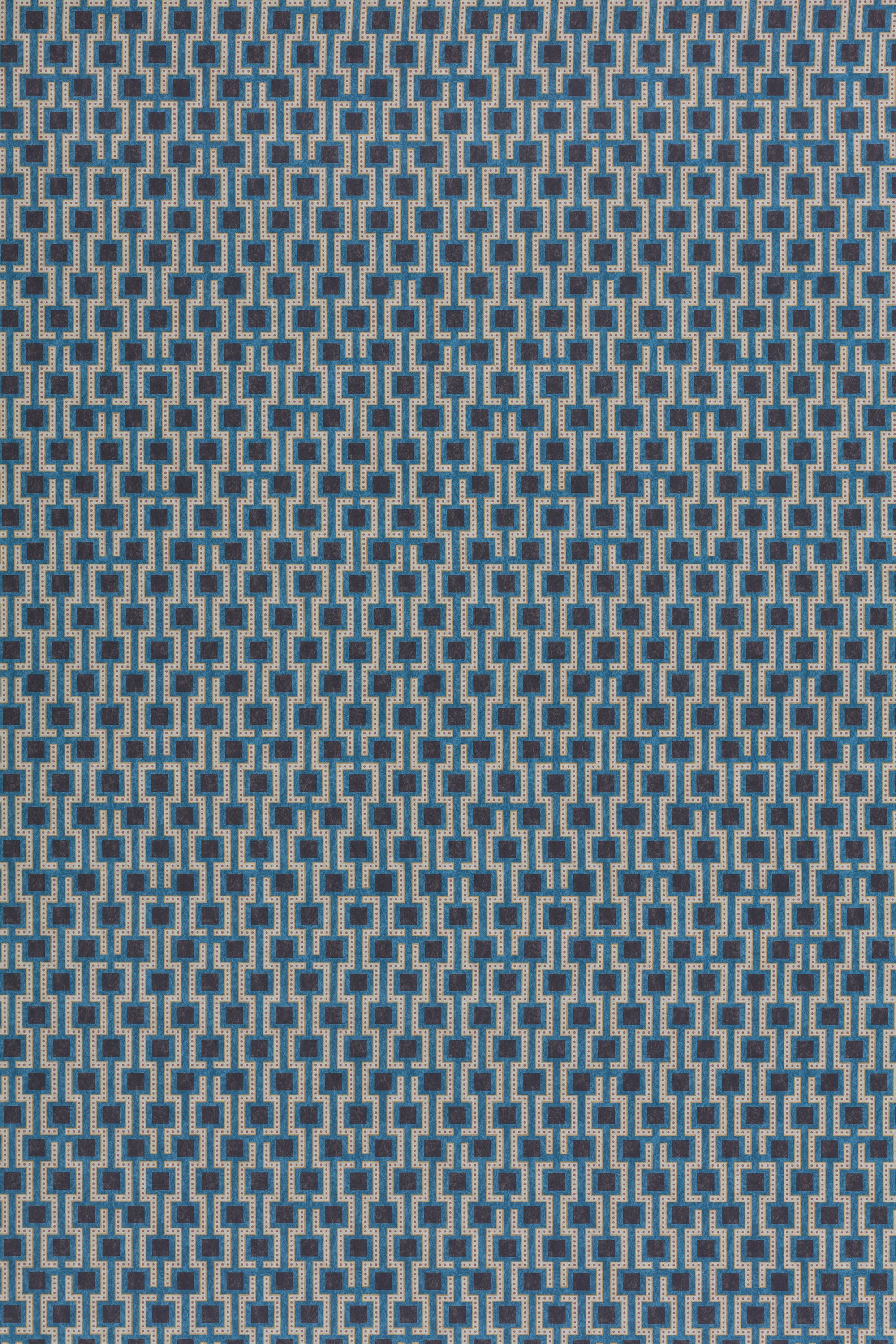 Wallpaper panel in a geometric grid print in shades of blue, red, navy and cream.