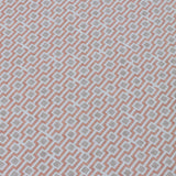 Detail of a wallpaper panel in a geometric grid print in shades of pink and gray.