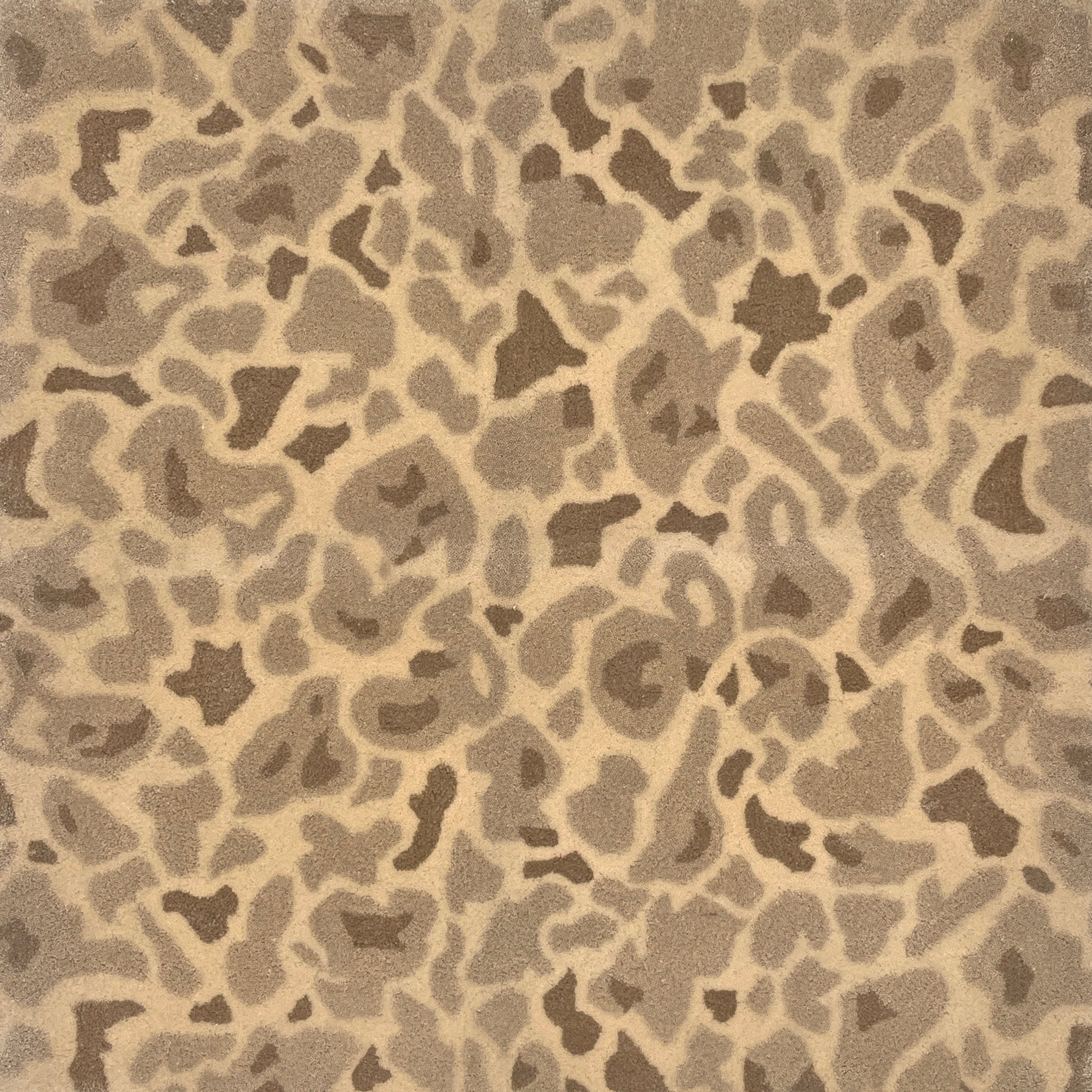 Handknotted rug with abstract animal motif in  neutral colors.  