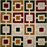 Geometric patterned rug with squares in various colors on a beige background
