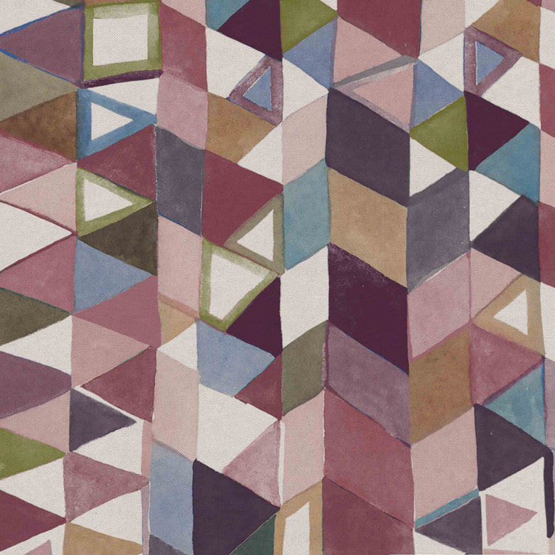 Detail of fabric in a playful repeating geometric print in shades of pink, purple, cream and green.