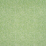 Fabric in a dappled animal print in shades of green on a cream field.