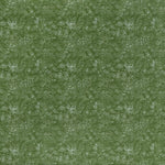 printed linen fabric in a dotted leaf pattern in white on a green field.