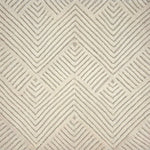 An ivory rug with a repeating raised chevron pattern on an ivory ground.