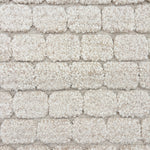 Morrocan handknotted rug sample with a raised brick pattern in ivory.