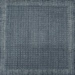 Handknotted rug sample with a tonal steel blue gridded motif.