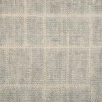 Textured carpet with a checkered pattern in gray and beige tones.