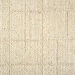 Textured carpet with a checkered pattern in cream tones.