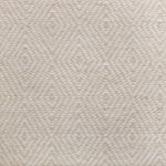 Broadloom sample in a dimensional diamond pattern in cream and ivory.
