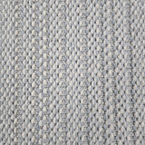 Broadloom carpet in a textured stripe in white and cool blue. 