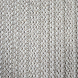 Broadloom carpet in a textured stripe in white and taupe. 