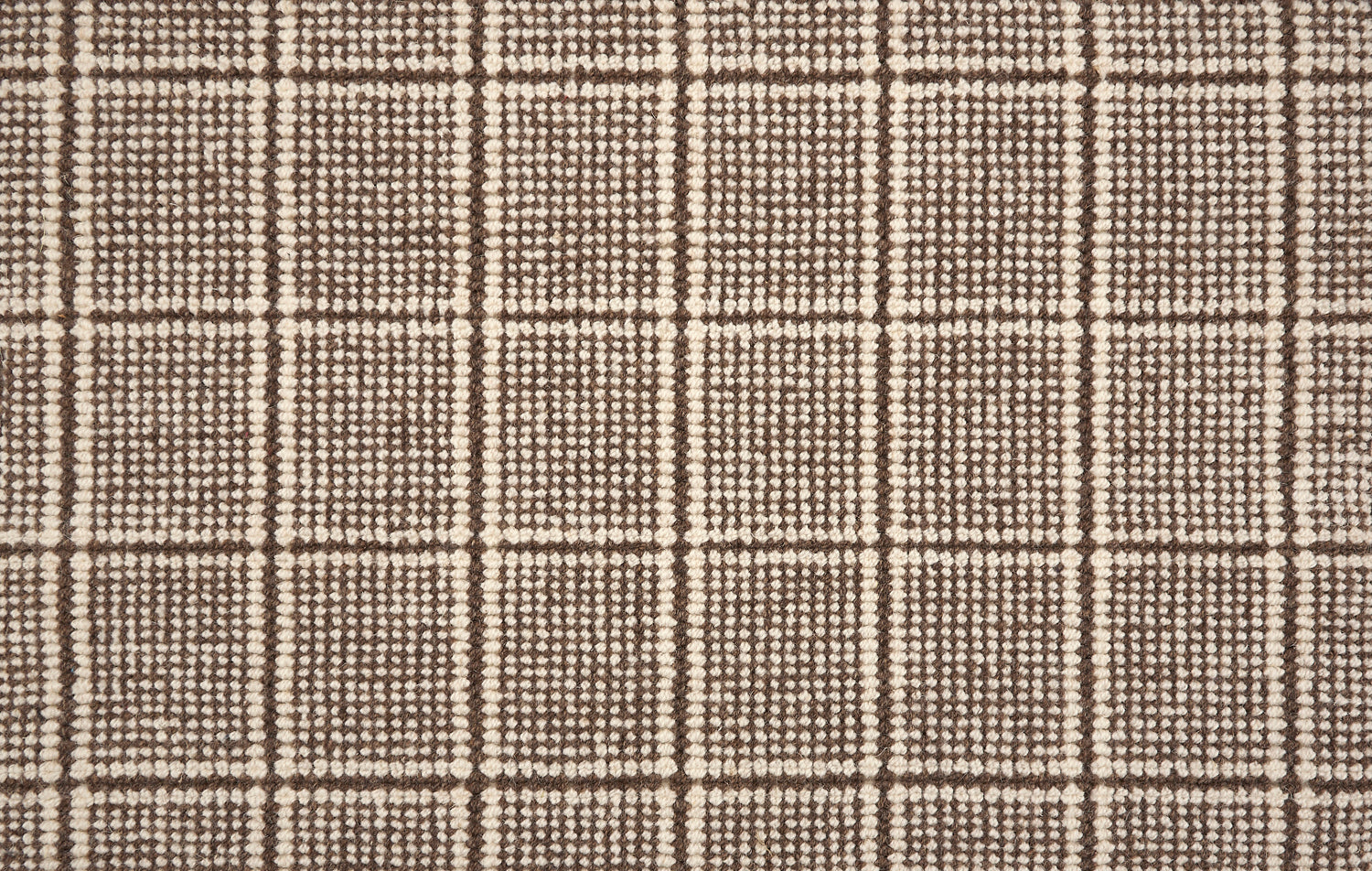 Broadloom carpet with windowpane check in cream and brown. 