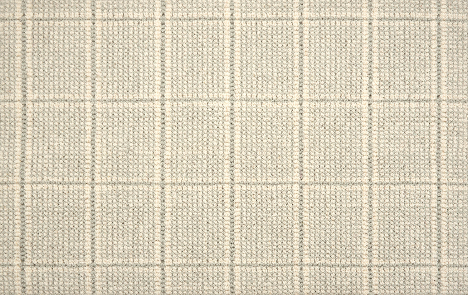 Broadloom carpet with windowpane check in cream and grey.