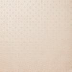 Detail of wallpaper in a honeycomb grid print in pastel pink on a cream field.