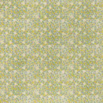 printed linen fabric in a painterly floral pattern in mustard and blue on a cream field.