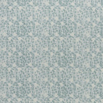printed linen fabric in a painterly floral pattern in shades of blue on a cream field.