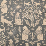 Detail of wallpaper in a lion and plant print in cream on a mottled gray field.