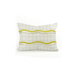 Rectangular throw pillow with an embroidered wave pattern in yellow and white on a repeating cream and greige diamond field.