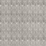 Detail of wallpaper in an art deco damask print in black on a white field.