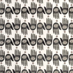 Detail of wallpaper in a playful hamsa hand print in black and brown on a cream field.