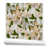 Partially unrolled wallpaper with a pattern of many different types of illustrated watercolor dogs. Background is hunter green.