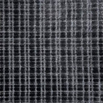 Broadloom carpet in a textural grid in charcoal grey. 