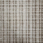 Broadloom carpet in a textural grid in taupe.