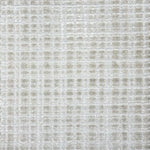 Broadloom carpet in a textural grid in ivory.