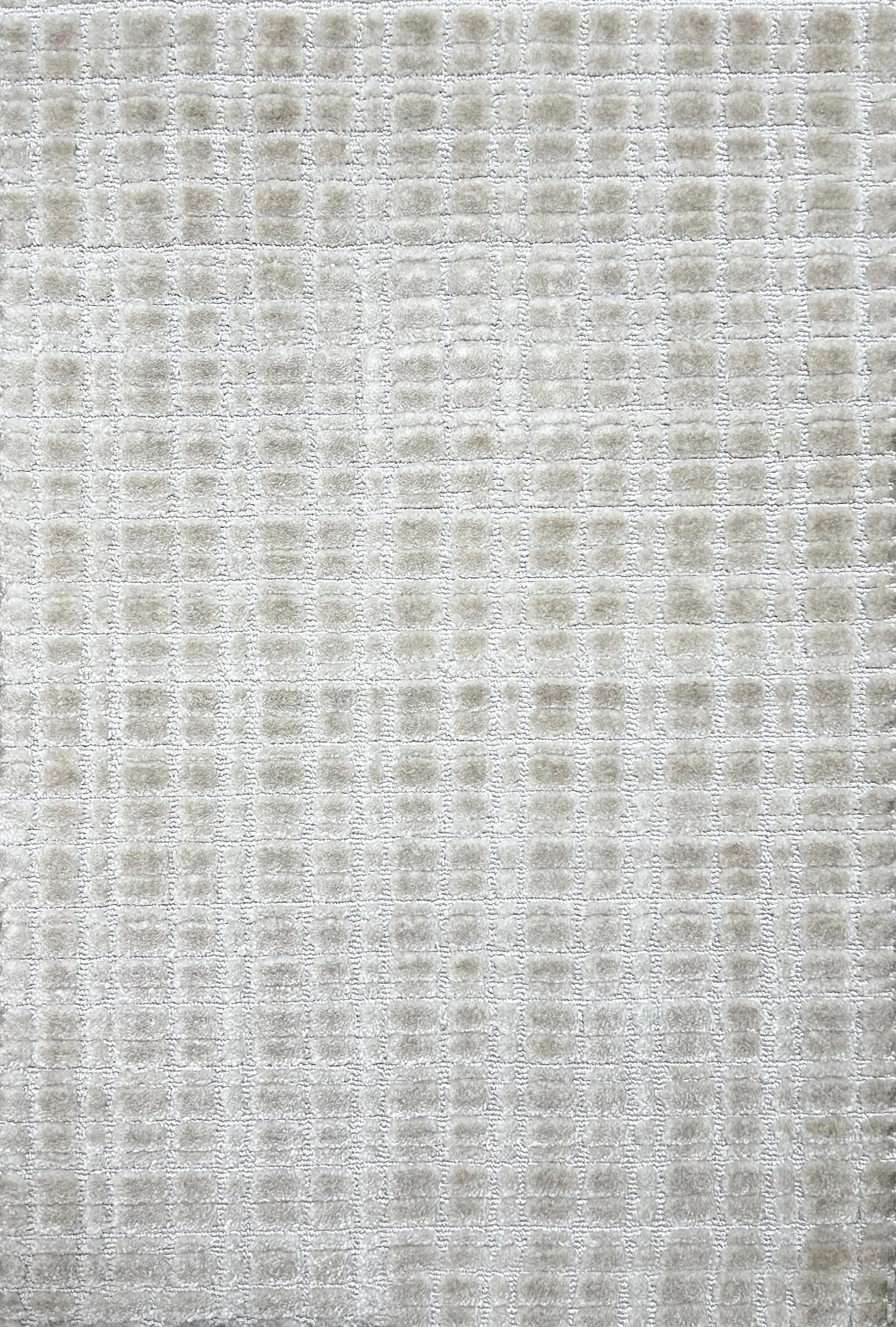 Broadloom carpet in a textural grid in ivory.
