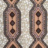 Decorative fabric strip with geometric pattern on a textured beige background