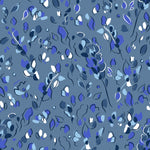 Detail of fabric in a painterly leaf print in shades of white, blue and navy on a blue field.