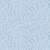 Detail of wallpaper in a painterly floral print in blue and white on a light blue field.