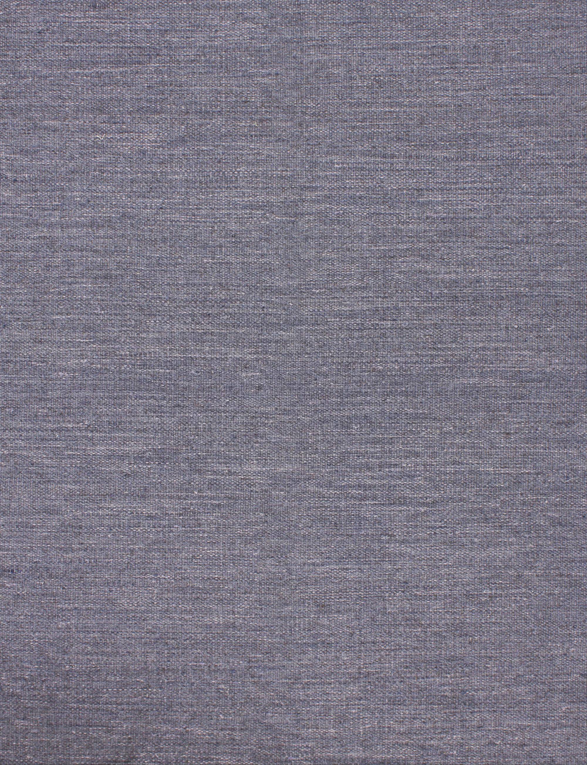 Broadloom carpet in a subtle textural solid in blue grey.