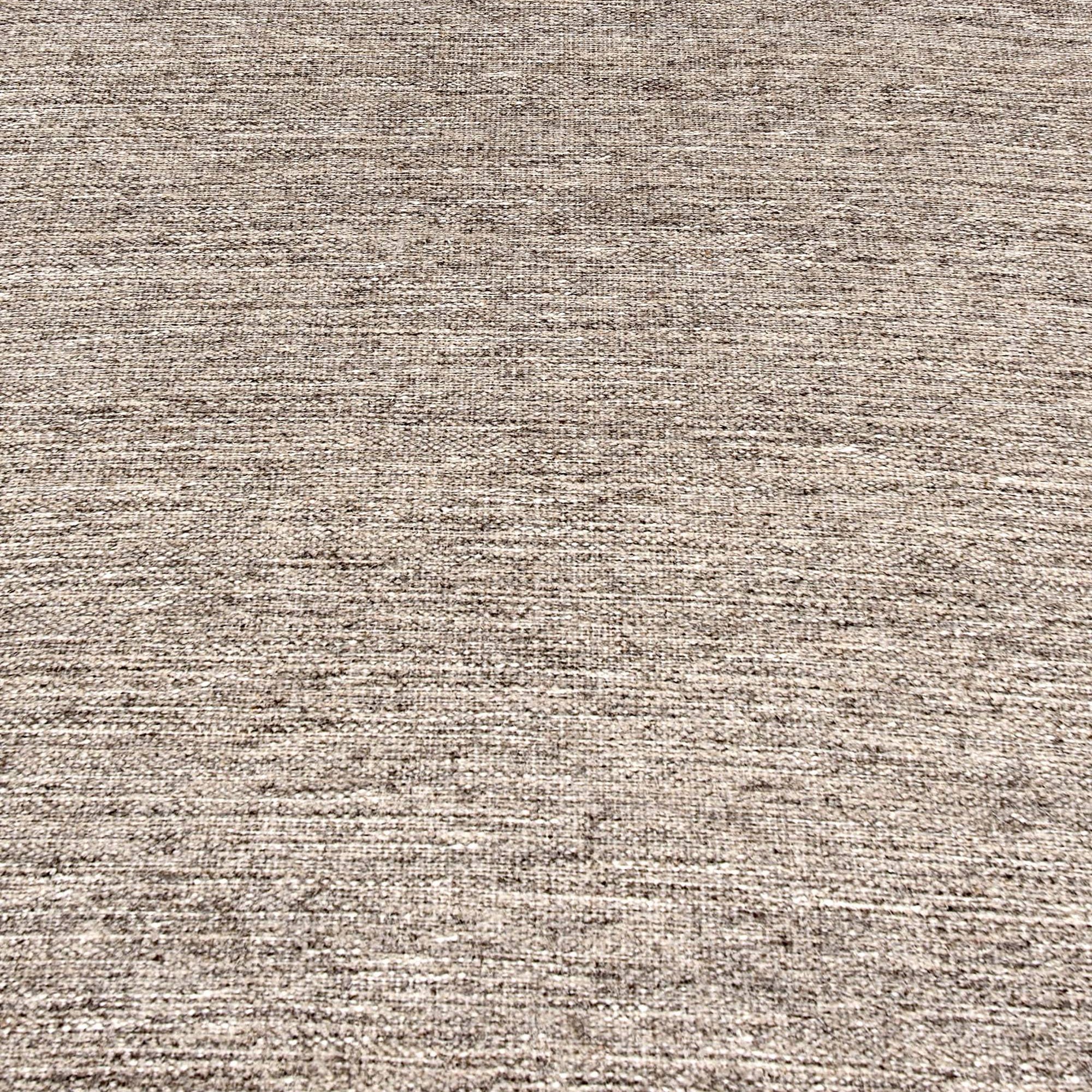Broadloom carpet in a subtle textural solid in taupe flannel.
