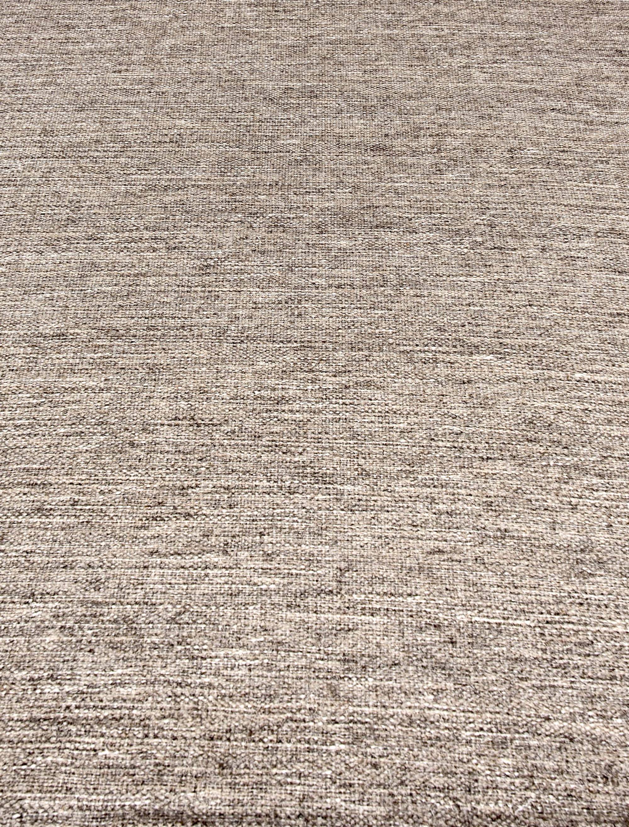 Broadloom carpet in a subtle textural solid in taupe flannel.