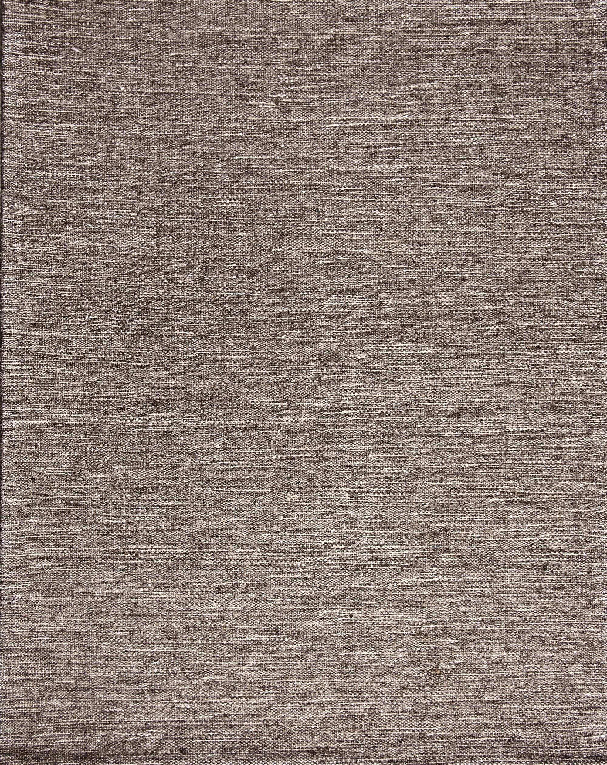 Broadloom carpet in a subtle textural solid in heather natural grey.