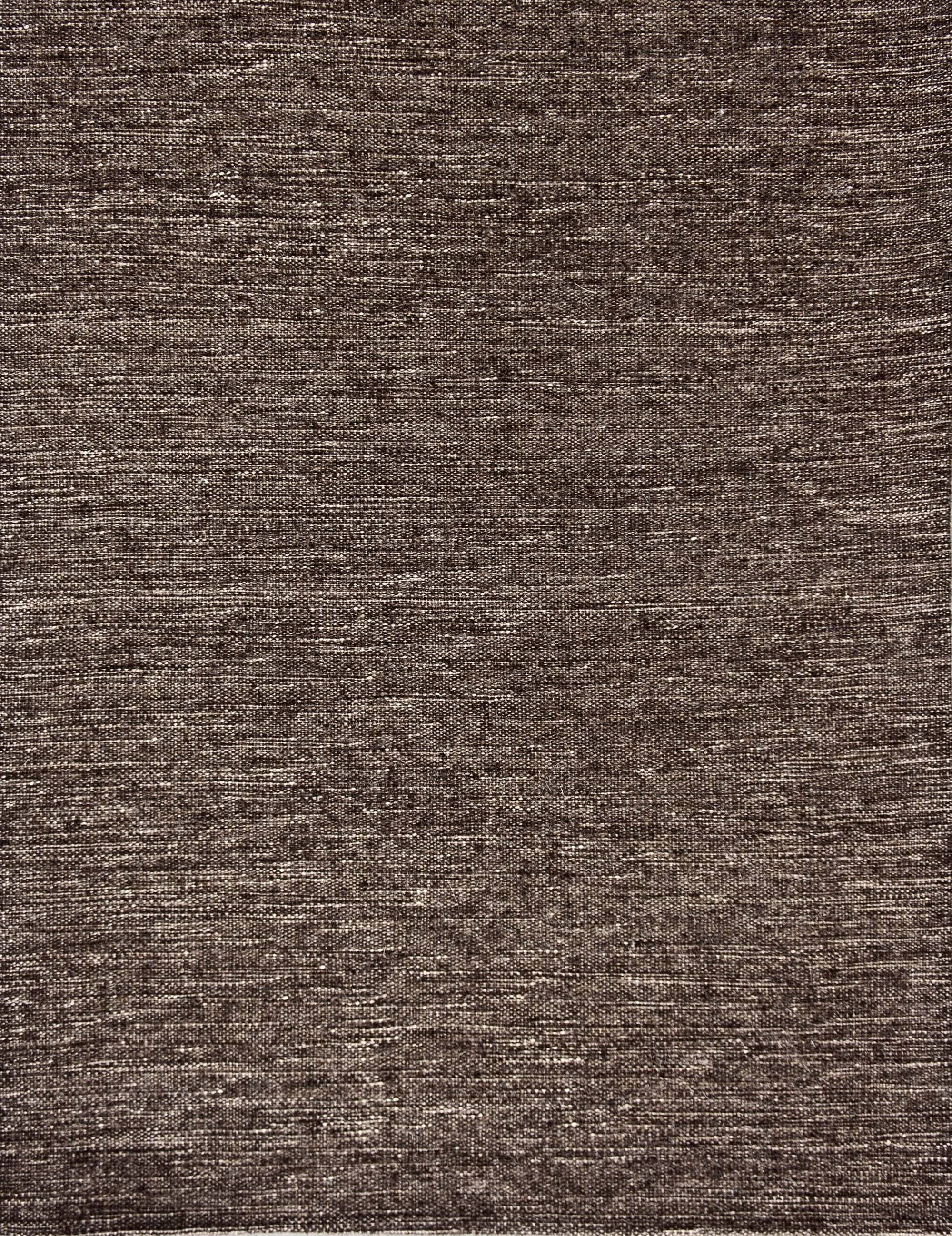 Broadloom carpet in a subtle textural solid in rock brown.